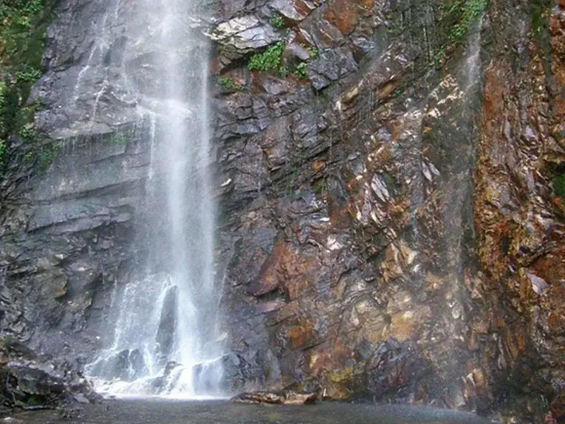 Peaceful mountain waterfall hidden in Jibhi forest trail